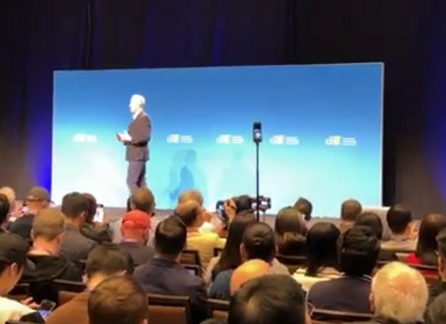 photo of speaker on stage