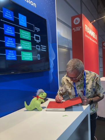 Bruce autographing a book